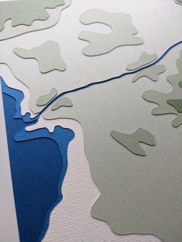 photo zoomed in to a section of a layered cut paper artwork