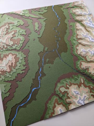 photo of layered cut paper artwork of Yellowstone River and Mill Creek area