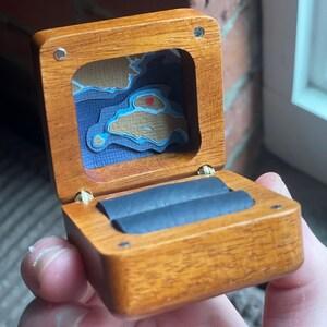 Tiny artwork on the inside of a ring box