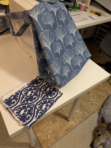 a fabric tote leaning against a sewing machine